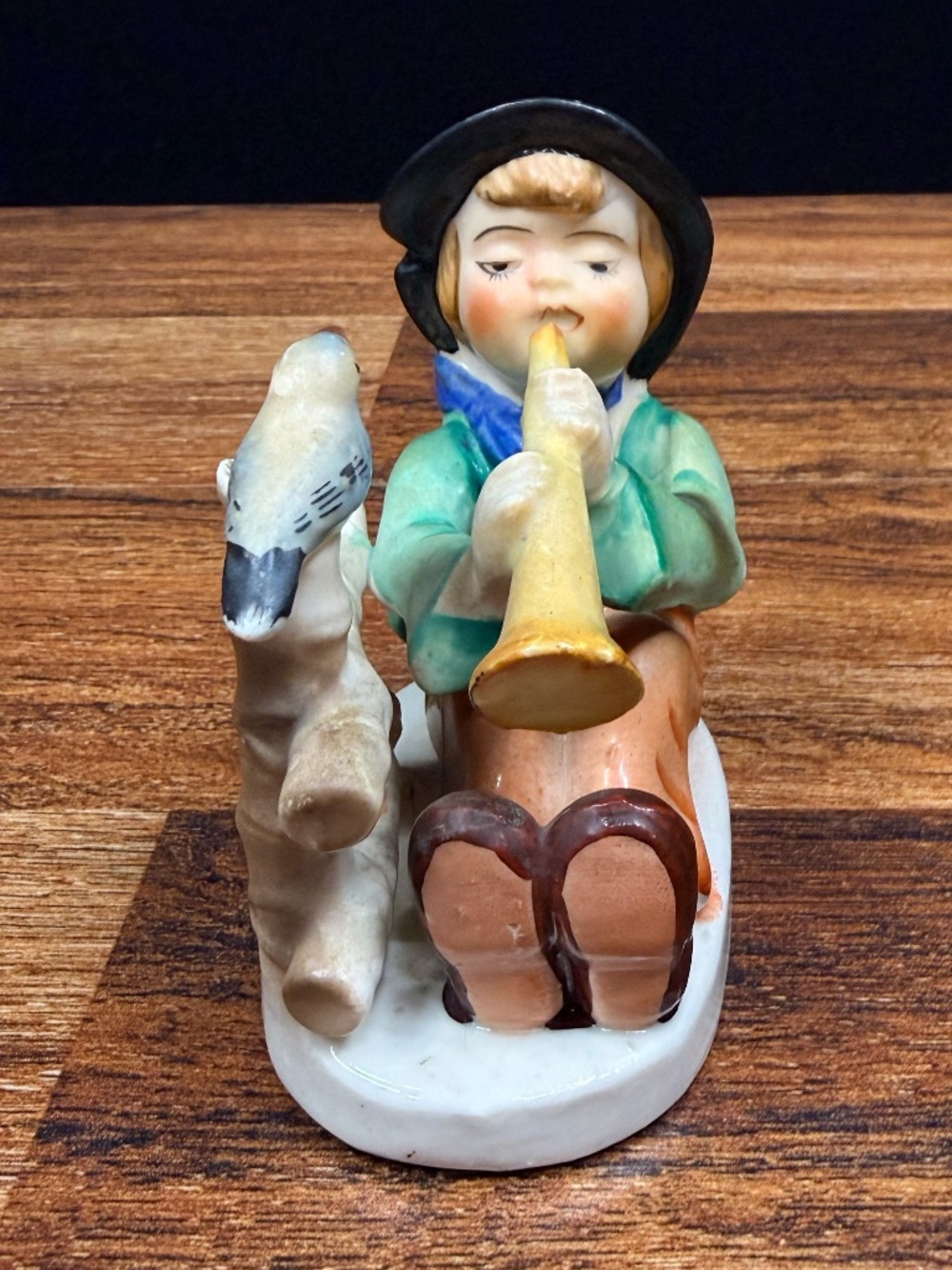 Figurine of Boy Playing Horn - Picture 5 of 15
